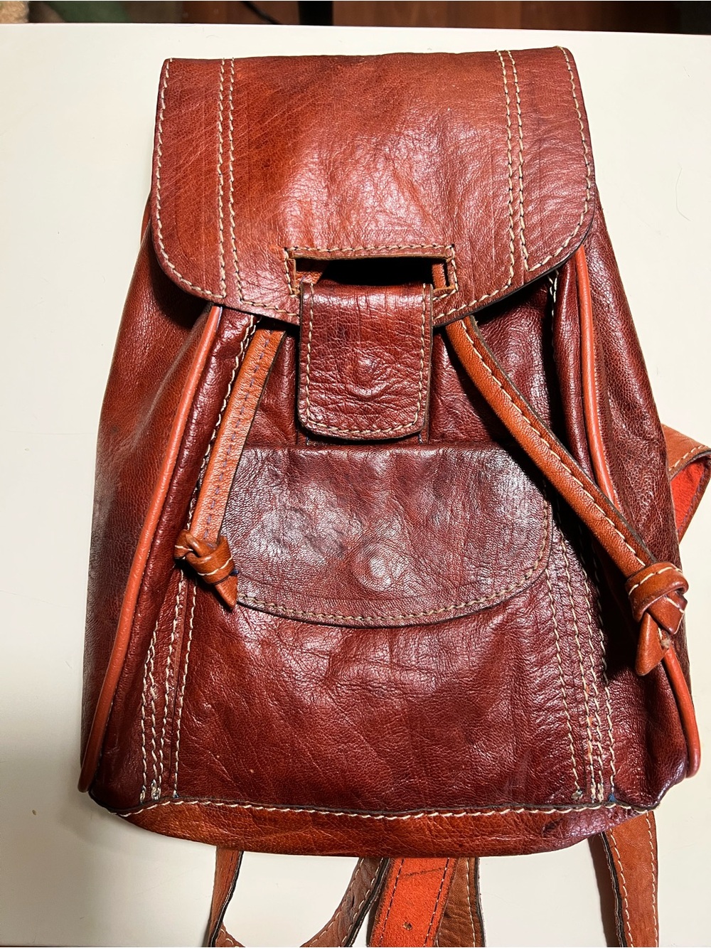 Vintage handmade mahogany colored leather back pack bag.